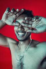 Image showing Man, hands and cover eyes in studio, smile and topless for body health and wellness on red background. Skin, person and aesthetic for cosmetics, skincare and healthcare with muscles and happy