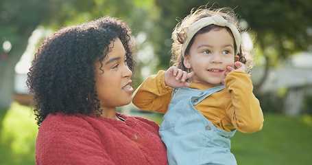 Image showing Family, children and a woman with her adopted daughter in the garden of their foster home together. Love, smile and kids with a happy mother holding her female child outdoor in the home backyard