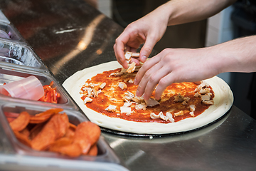 Image showing making pizza at kitchen of pizzeria