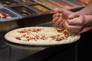 Image showing making pizza at kitchen of pizzeria