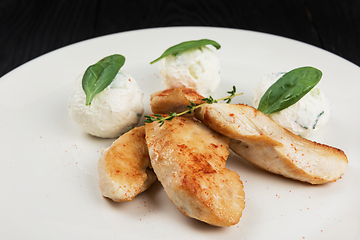 Image showing Grilled chicken breast with mozzarella cheese.