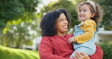 Image showing Family, kids and a mother with her adopted daughter in the garden of their foster home together. Love, smile and children with a stepmother holding her female child outdoor in the home backyard