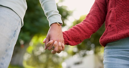 Image showing Family, holding hands and mother with child outdoor, bonding and travel. Support, walking and mom with kid for safety, security and care, trust and love while enjoying quality time together in nature