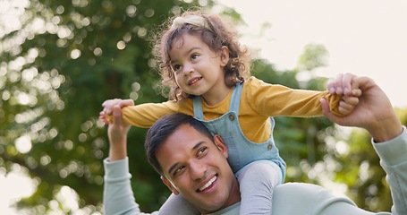 Image showing Happy, piggyback and father with girl in nature, bonding and having fun. Smile, dad and carrying child on shoulders, play and enjoying quality family time together outdoor in park with love and care.