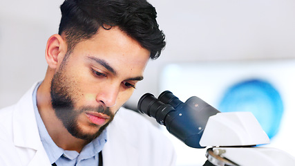 Image showing Laboratory scientist using microscope to examine monkeypox virus and note his discovery. Closeup of serious biochemist engineer doing medical research with scientific equipment for breakthrough cure