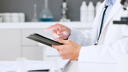 Image showing Laboratory scientist scrolling on a digital tablet and examining a dna test reaction to monkeypox virus during medical research. Biochemical engineer searching for a breakthrough cure on technology