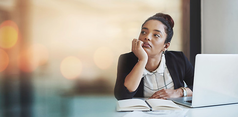 Image showing Laptop, notebook and a bored business woman in her office thinking or problem solving on banner space. Computer, research and idea with a young employee looking for inspiration in the workplace