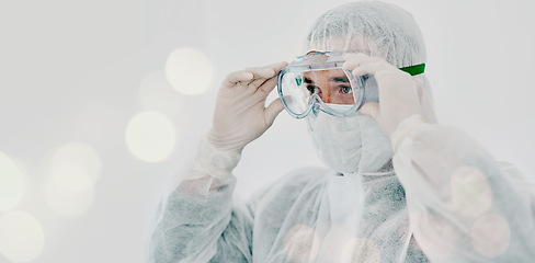 Image showing PPE, person goggles and safety suit of lab worker and healthcare professional in hospital or clinic. Cleaning, bacteria protection and face mask with virus, pharmacy and wellness research with bokeh