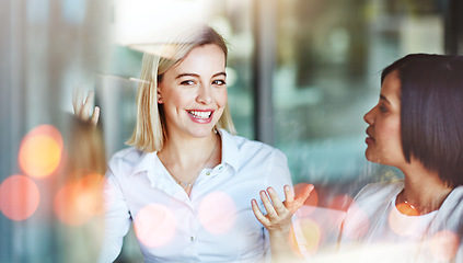 Image showing Business women, office and happy conversation with teamwork and bokeh with communication. Collaboration, planning and employee with professional discussion and worker with startup company talk