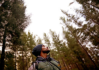 Image showing Hiking, man and ufo in forest, spaceship or mystery adventure in countryside to travel. Trekking, alien and person in woods with flying saucer, science fiction and extraterrestrial conspiracy theory.