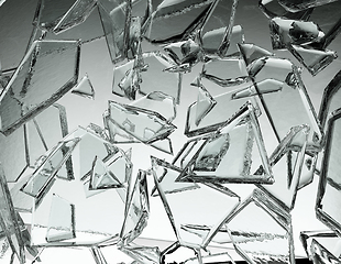 Image showing Pieces of glass broken or cracked on grey