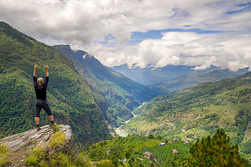 Image showing Man standing on hill top in Himalayas