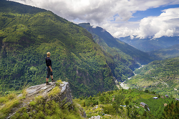 Image showing Man standing on hill top in Himalayas