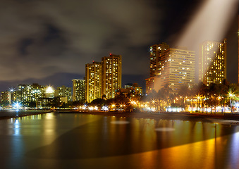 Image showing Spaceship light, ufo and city at night for alien mission, science fiction and fantasy in sky with surreal glow. Spacecraft, mystery and flying saucer from outer space for discovery and invasion