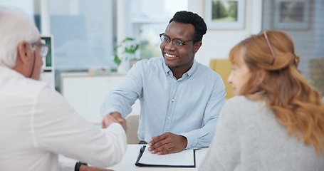 Image showing Senior couple, insurance agent and handshake with planning and investment at meeting. Finance, shaking hands and agreement deal for accounting and retirement budget for income savings with thank you