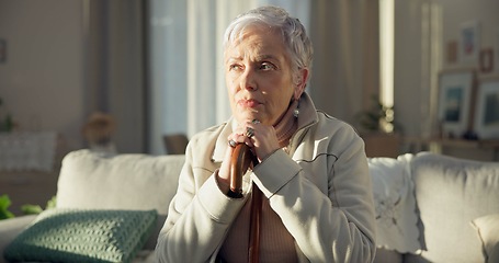 Image showing Home, thinking and old woman with depression, memory and remember with thoughts, wonder and sad. Female person, mature lady and pensioner on a couch, nursing facility and retirement with Alzheimer