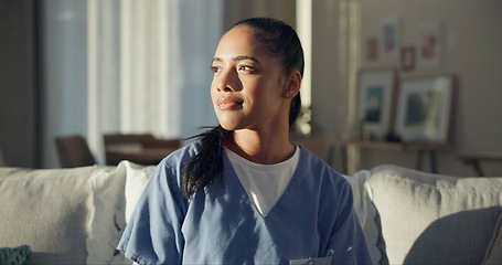 Image showing Calm, thinking and a nurse or woman on the sofa to relax from a career in healthcare in a house. Smile, peace and a medical employee or doctor with an idea or vision on the couch for a memory