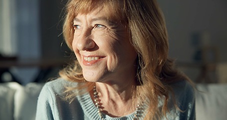 Image showing Happy, thinking and a senior woman on the sofa in a home living room for peace, calm and retirement. Smile, idea and an elderly person with a vision, hope and relax on the lounge couch of a house