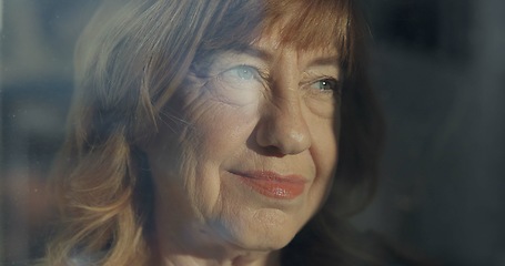 Image showing Smile, thinking and a senior woman at a window in a home for the morning view, idea or calm. Happy, planning and an elderly person with hope while in a house during retirement and vision for old age