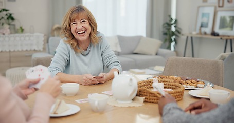 Image showing Tea, happy and retirement with friends and playing cards in living room for relax, diversity and poker. Games, smile and community with group of old people in nursing home for party and celebration