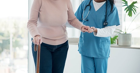 Image showing Caregiver hands, disabled and old woman with walking stick for support, senior wellness care or movement disability. Elderly rehabilitation service, retirement home and nurse help patient with cane