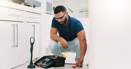 Image showing Plumber man, tools and box on floor maintenance with packing, focus and pipe repair service in house. Entrepreneur handyman, plumbing expert and small business owner with toolbox in home kitchen