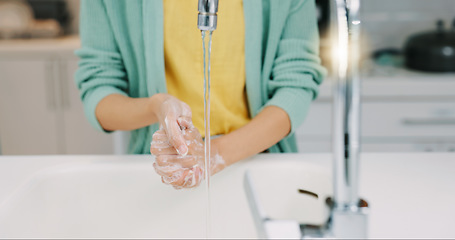 Image showing Washing soap, woman hands and kitchen sink of a female with foam for cleaning and wellness. Home, safety and virus protection of a person with sanitary healthcare in a house for skincare and grooming