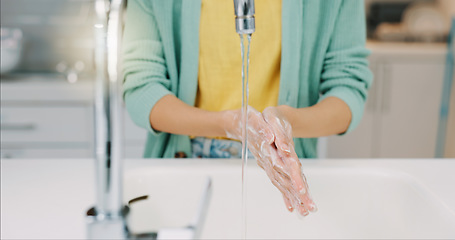 Image showing Washing hands, woman and water from kitchen sink with soap for cleaning and wellness. Home, safety and virus protection of a person with sanitary healthcare in a house for skincare and grooming