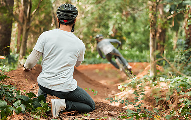 Image showing Man, bicycle and forest with photographer, speed and off road for race, cycling video or post on web blog. Guy, bike and recording for vlog, live stream or social network in woods for outdoor sports