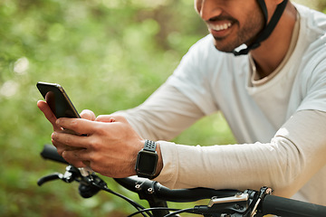 Image showing Man, forest and phone on bicycle, texting or smile for web chat notification for adventure on location. Guy, cycling and smartphone for search location with bike, relax or social network app in woods