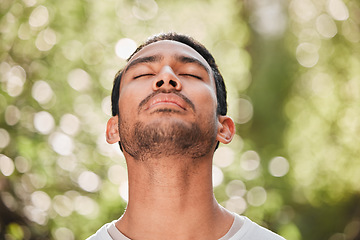 Image showing Man, breathing and relax with peace in nature for exercise, workout or meditation for zen after fitness for spiritual wellness. Calm, athlete and freedom in environment and training mindfulness