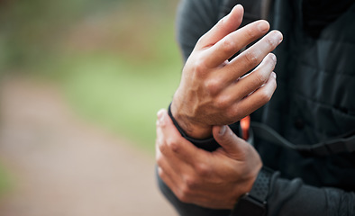 Image showing Wrist, pain and hands of man in sports, outdoor and training with a medical accident, crisis or problem with anatomy in nature. Exercise, injury and athlete with trauma to muscle, joint or hand