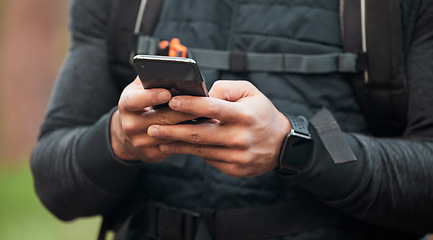 Image showing Closeup, man and runner with a cellphone, typing and connection with tracking progress, network or contact. Person, runner or hands with digital app, smartphone or break with fitness and social media