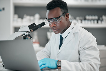 Image showing Microscope, laptop and black man with research, medical and typing with data analytics, digital app and chemistry. African person, biologist or scientist with a computer, lab equipment and healthcare