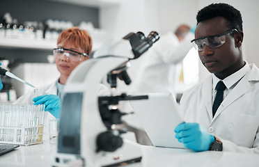 Image showing Science, team and working in laboratory to research solution, chemistry investigation and medical data. Scientist, black man and review information on digital tablet, test results and biotechnology