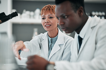 Image showing Science, team and research on laptop in laboratory for solution, healthcare investigation or planning medical data. Scientist, woman and collaboration with man to review test results info on computer