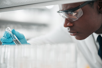 Image showing Science, medical or black man with research, test tube or sample with experiment, vaccine development or result. African person, scientist or employee with cure, data analysis or laboratory equipment