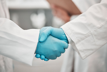 Image showing Closeup, medical and research with handshake, people and agreement with promotion, cooperation and partnership. Teamwork, scientists and staff shaking hands, welcome and gloves with collaboration