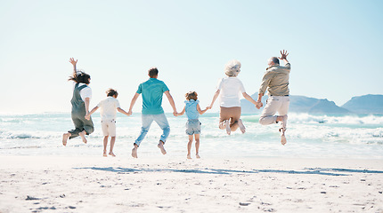 Image showing Jump, energy and holding hands with big family on the beach for support, summer vacation and travel. Freedom, health and love with people on seaside holiday for adventure, trust or happiness together