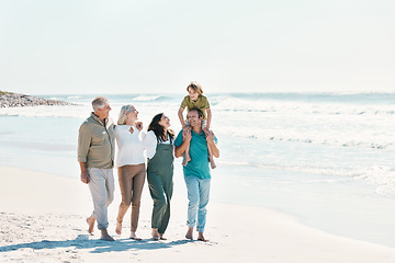 Image showing Relax, travel and walking with big family on the beach for support, summer vacation or bonding. Freedom, health and love with people on seaside holiday for adventure, trust or happiness together