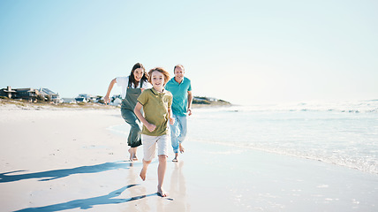 Image showing Running, travel and happy with family on beach for energy, freedom and summer vacation. Love, relax and adventure with people playing on seaside holiday for health, bonding and games together