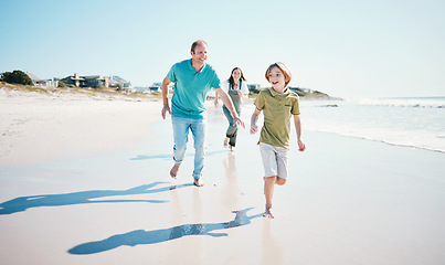 Image showing Running, fun and happy with family on beach for energy, freedom and summer vacation. Love, relax and travel adventure with people playing on seaside holiday for health, bonding and games together