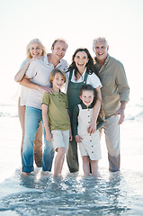 Image showing Grandparents, kids and big family with portrait at beach, hug or bonding for love, sunshine or excited in water. Men, women and children by sea, waves or happy embrace for holiday for summer in Spain