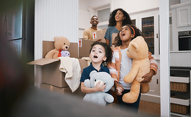 Image showing Family, moving and living room with kids, father and love together in a new home with toys. Mother, youth and children with dad and cardboard boxes with help, laugh and care in a house with a smile