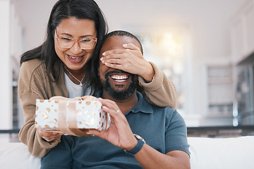 Image showing Birthday gift surprise, cover eyes and happy couple giving Christmas package for love, congratulations or gratitude. Lounge sofa, support care and home man, woman or people celebrate with present box