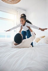 Image showing Airplane, fun and bedroom with family laughing at home with a happy father and young girl together. Smile, bonding and love of a dad and child on a bed with plane game in a house with care and joy