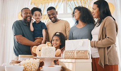 Image showing Big family, birthday and celebration cake with kids, father and love together in a home with smile. Event, presents and children with dad and singing with bonding, candles and care in a house