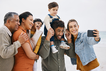 Image showing Happy family, grandparents and selfie on beach for kids holiday, vacation and outdoor on social media. Mother, father and senior people with interracial children in profile picture by the ocean