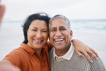Image showing Ocean, senior or selfie portrait of happy couple with love, smile or support for a romantic bond together. Beach, old man or elderly woman taking photograph or picture memory in retirement in nature