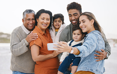 Image showing Family, grandparents and children in selfie on beach for holiday, vacation and outdoor on social media. Happy mother, father and senior people with interracial kids in profile picture or photography